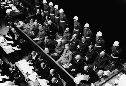 German war crimes defendants sitting in a courtroom at the Nuremberg trials in November 1945. Among them are Hermann Goering, Rudolf Hess and Joachim Von Ribbentrop. 